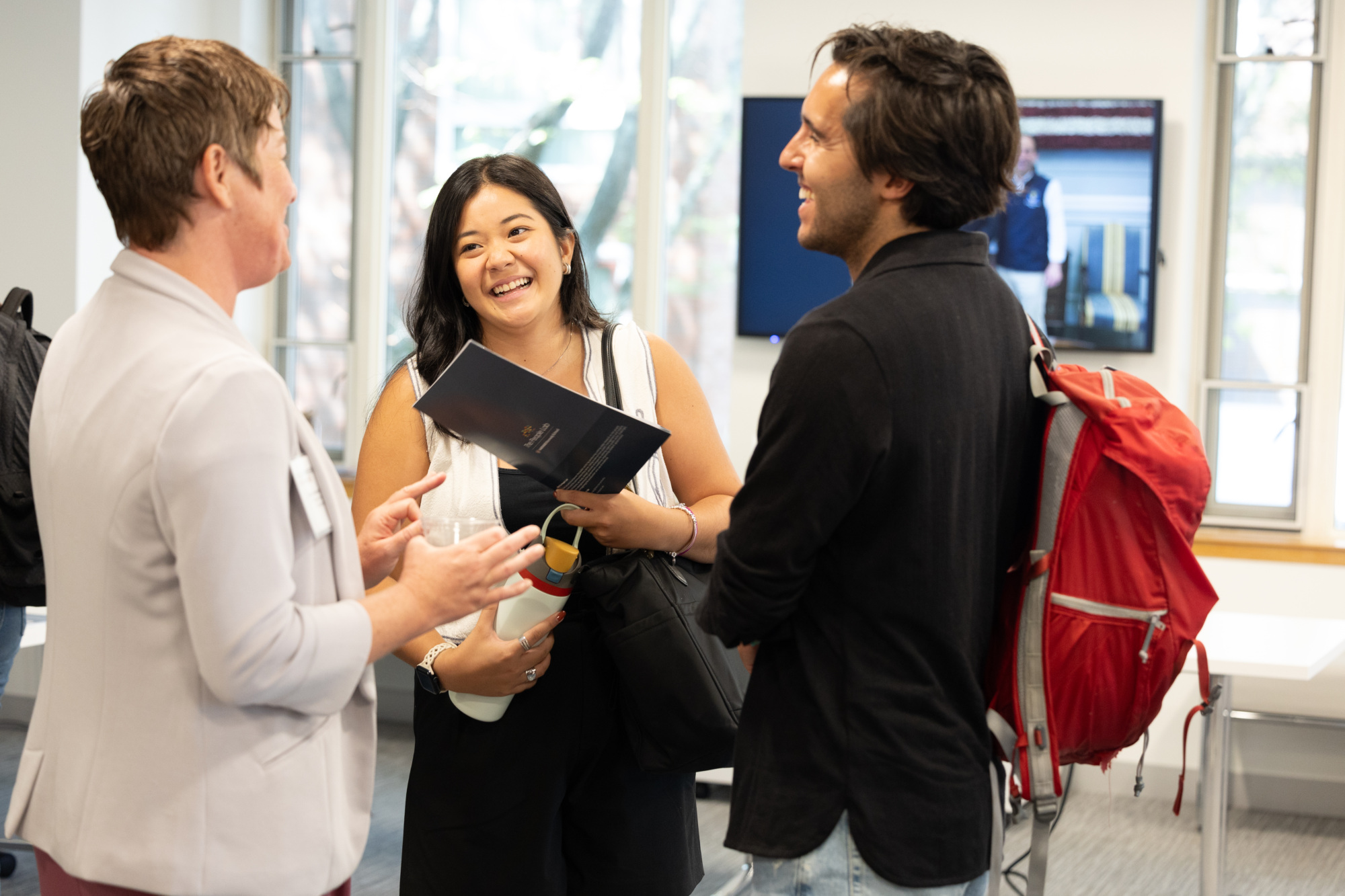 students talking with faculty